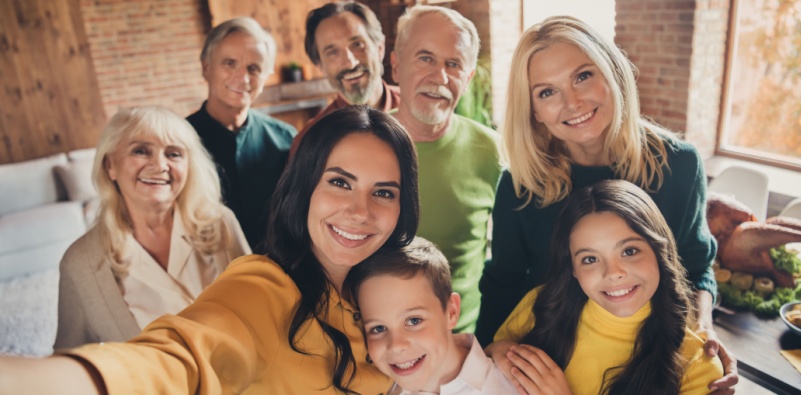 A family selfie with multiple generations including grandchildren, parents and grandparents.