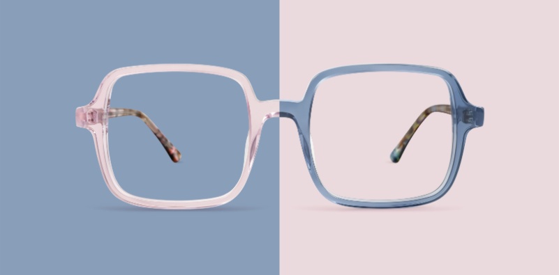 A pair of colourful glasses split in half. Pink side on a blue background and blue side on a pink background.