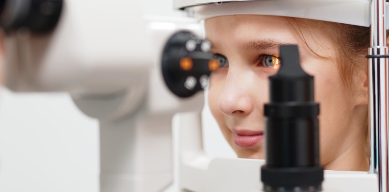 A young girl having an eye test at the opticians