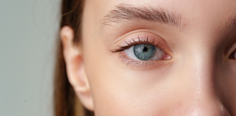 A close-up image of a woman’s blue eye